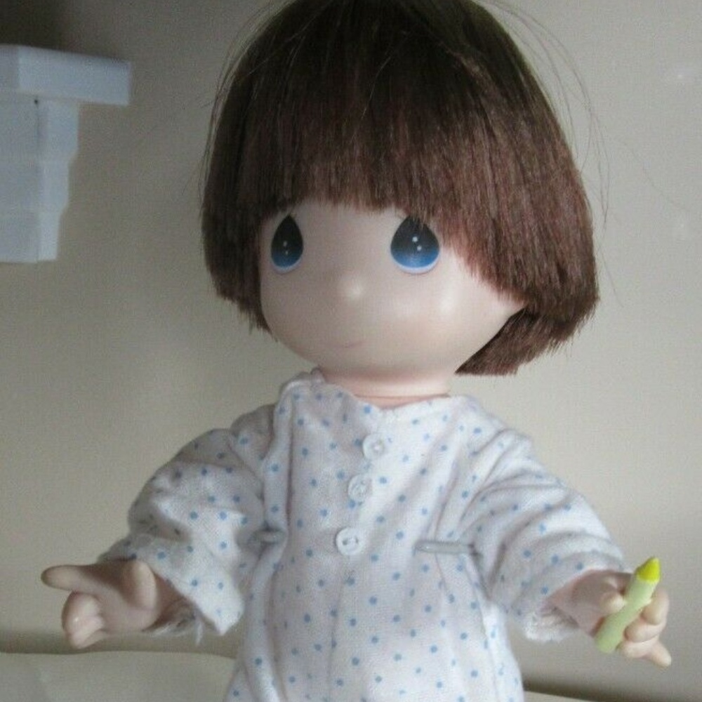 Precious moments doll on stand 1994 Holding a cray